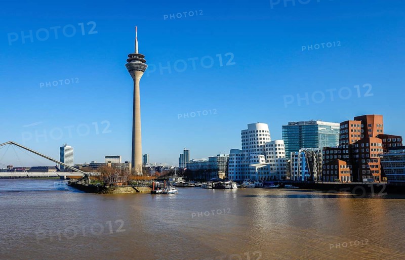City panorama at the Media Harbour with Gehry buildings at the new Zollhof and Rhine Tower