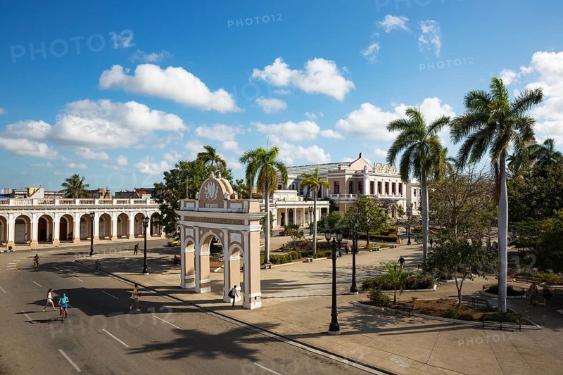Porticoed Neoclassical buildings frame the Parque Jose Marti