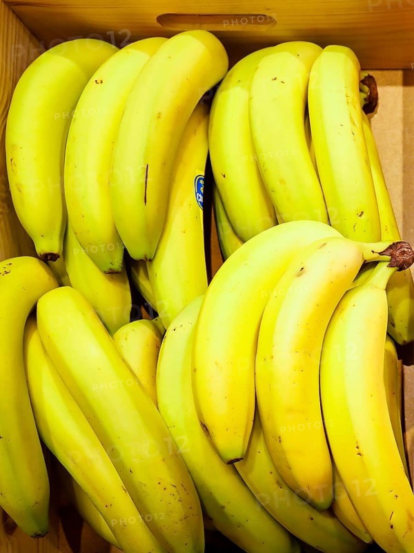 Bananas lying in a wooden box