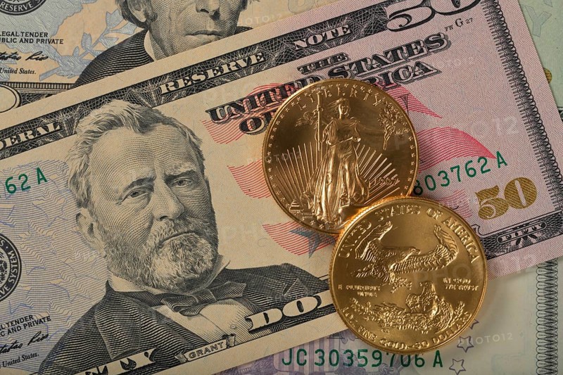 Physical gold coin 1 oz American Gold Eagle obverse and reverse Lady Liberty on 50 US dollar banknote