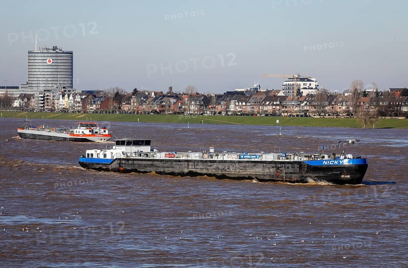 Freighters navigating on the Rhine during floods