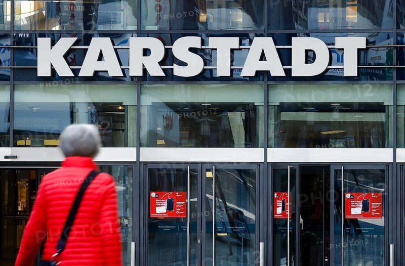 Passers-by in front of the entrance of the Galeria Karstadt Kaufhof store in the Limbecker Platz shopping centre
