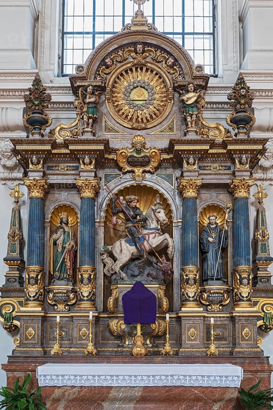 Side altar with figures of saints and the dragon slayer St. Michael