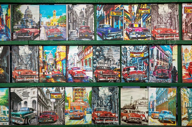 Retro style tin plaques of US classic cars at a souvenir stall