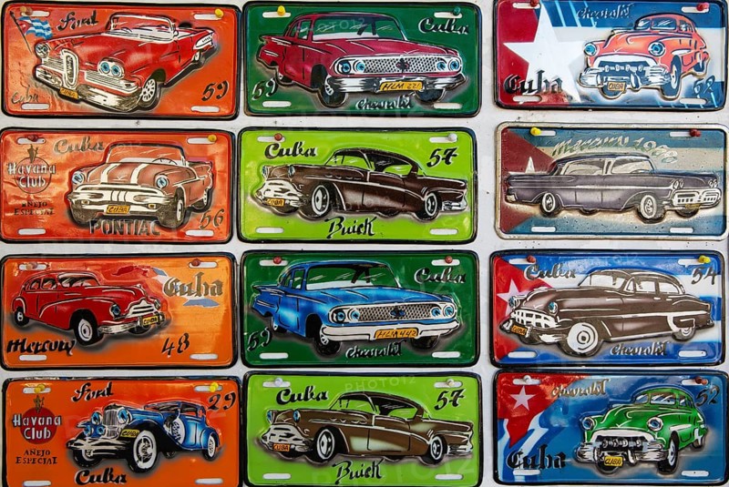 Retro style tin plaques of US classic cars in a souvenir shop