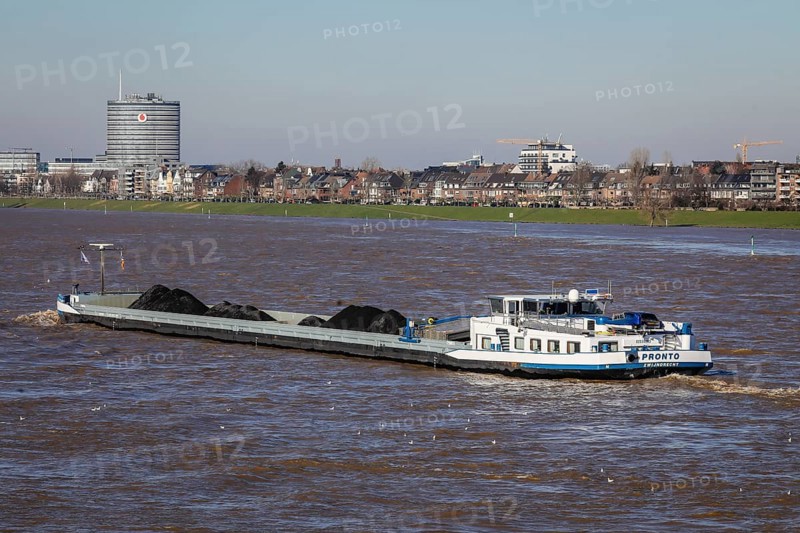 Freighters navigating on the Rhine during floods