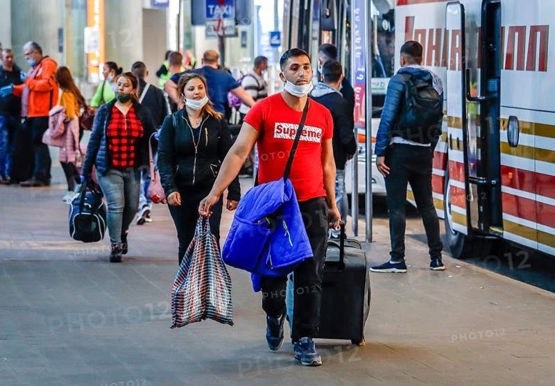 Romanian harvest workers land at Duesseldorf airport with special machines and travel by bus to the farms