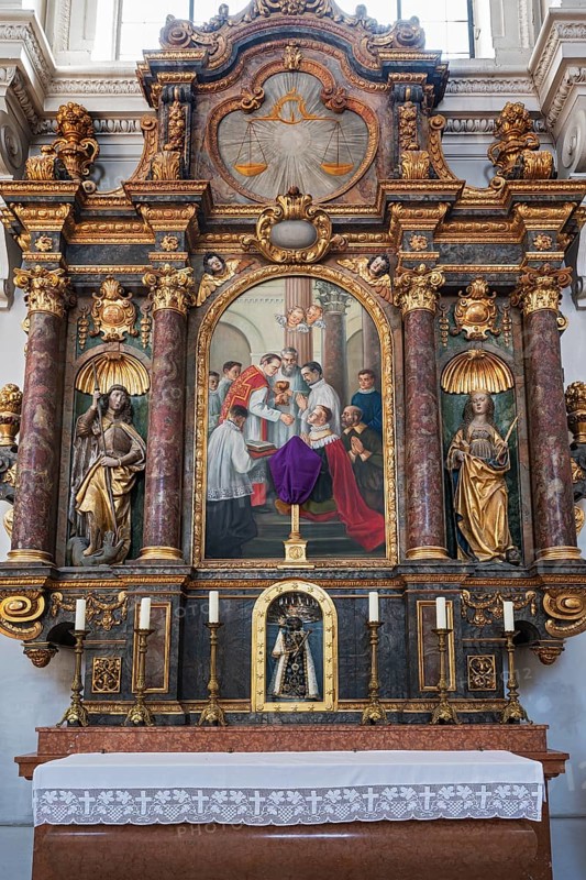 Side altar with figures of saints and black Madonna