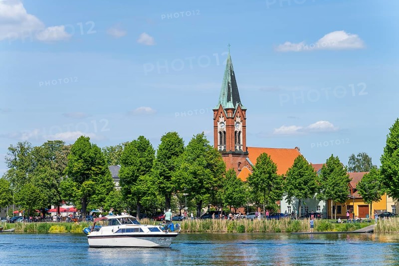 Motorboat on the Havel in front of the island church Maria Meeresstern