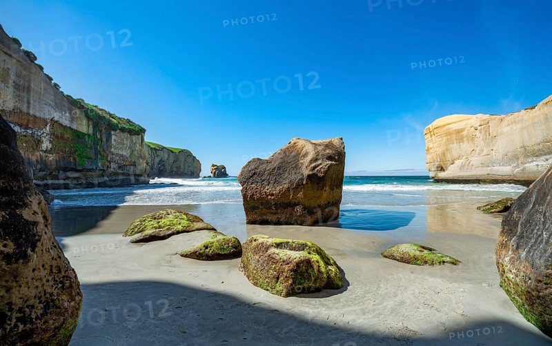 Sand beach with sandstone cliffs