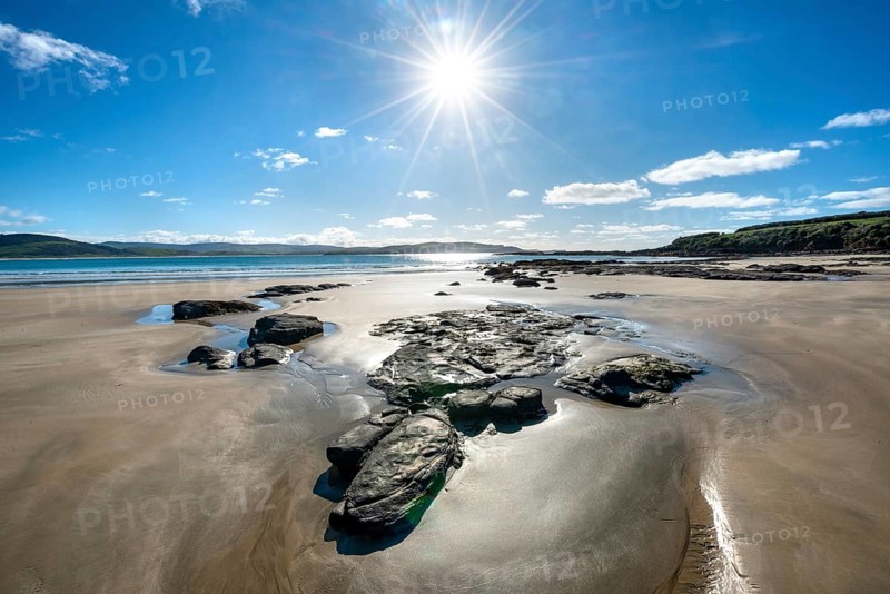 Stones on sandy beach