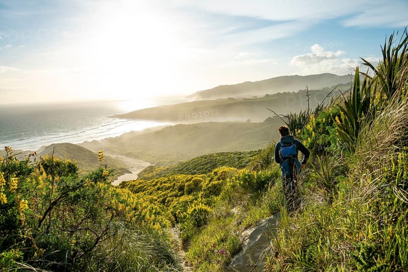 Young man looking over a bay
