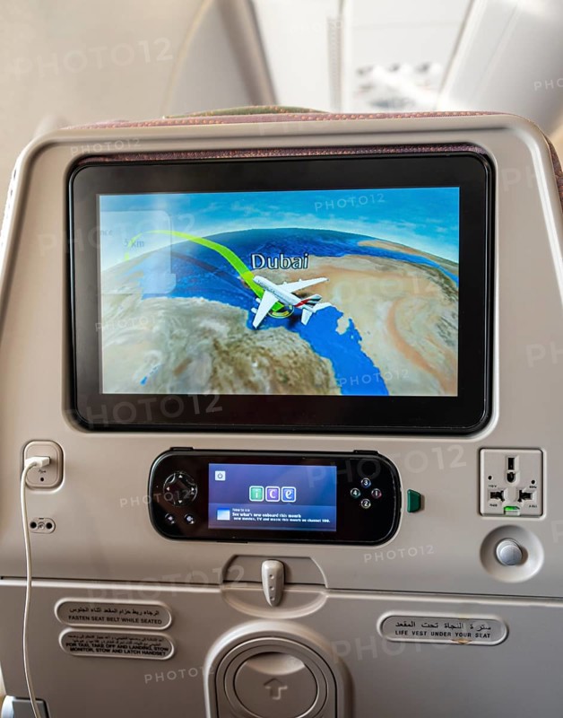 Screen showing flight position Dubai on backrest in aircraft