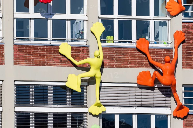 Flossi sculptures on house wall