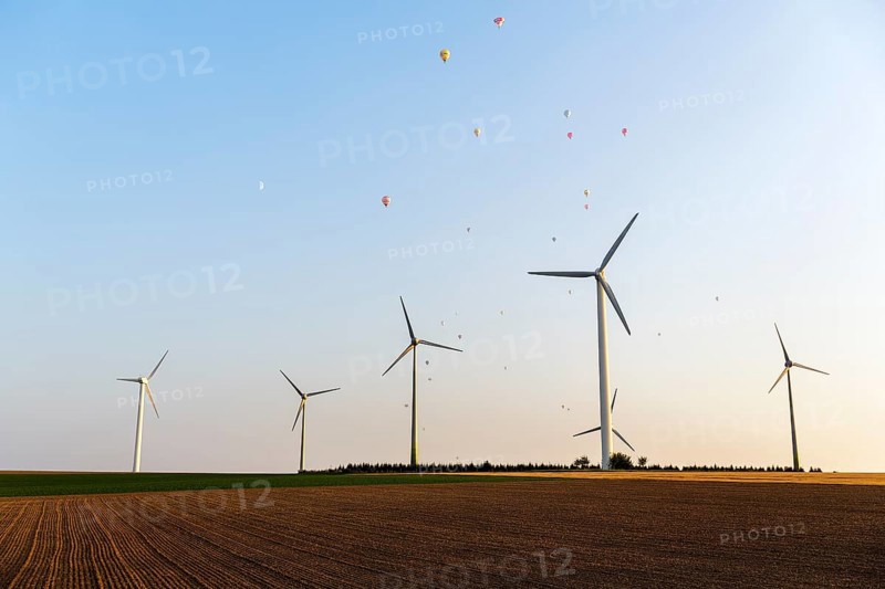 Wind turbines between fields