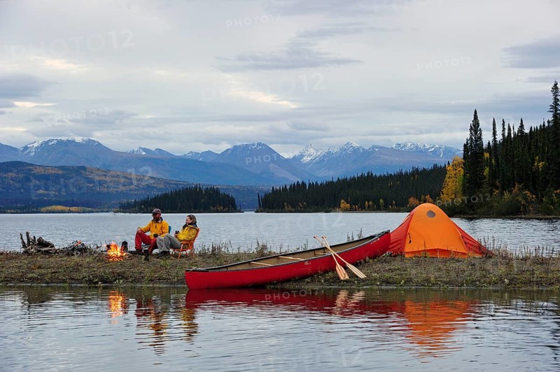 Couple around a campfire