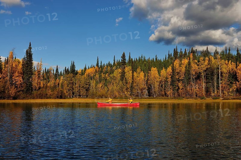 Couple canoeing in lake