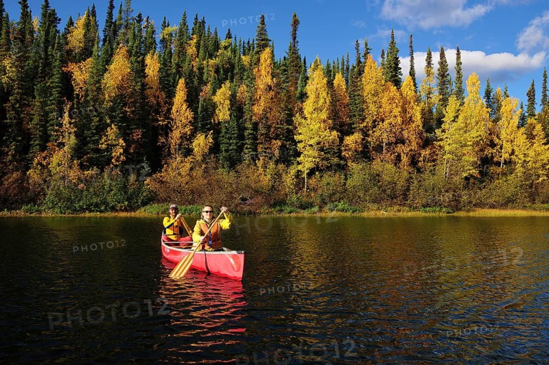 Couple canoeing in lake