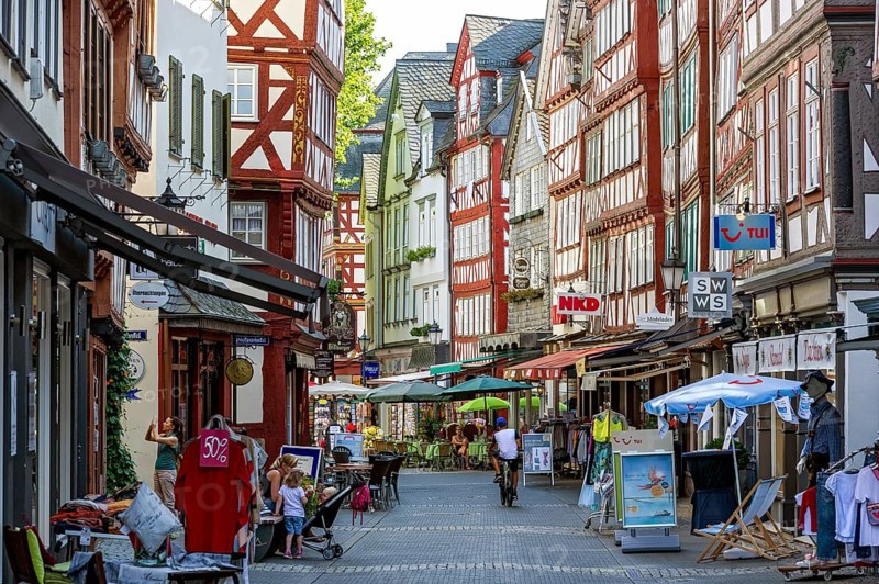 Shopping street with historic half-timbered houses