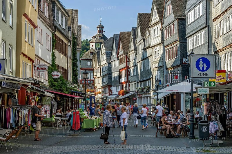Shopping street with historic half-timbered houses