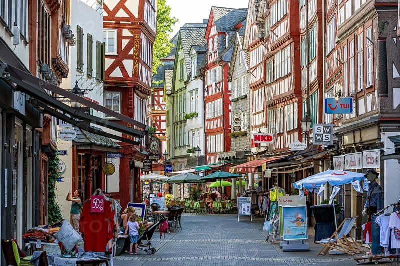Shopping street with historic half-timbered houses