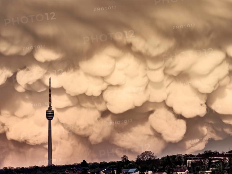 TV tower in front of dramatic mammatus clouds in the evening