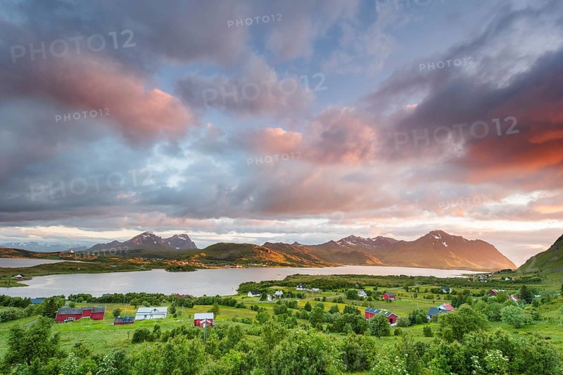 View over the lake Ytterpollen near Borg in the evening mood with pink clouds