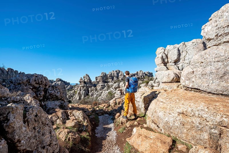 Young man on a hiking trail