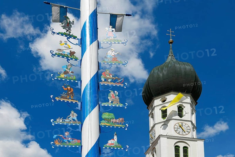 Maypole and church St. Benedikt