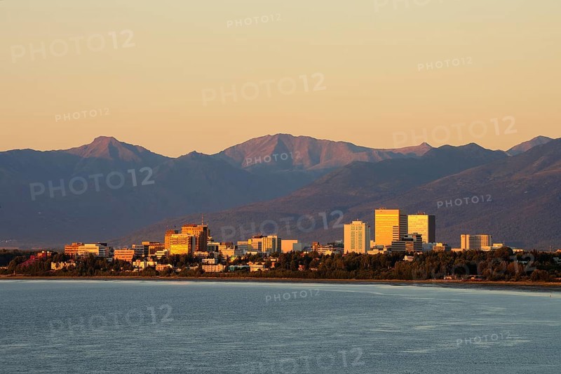 Skyline in the evening light in front of mountain range