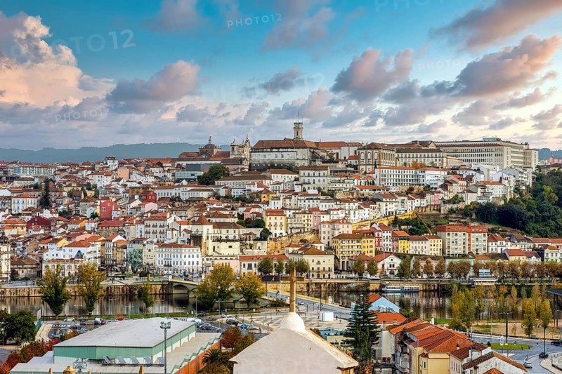 Coimbra cityscape with Mondego river by sunset