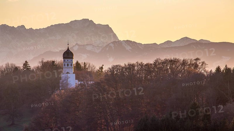 Church St. Johann Baptist protruding from trees