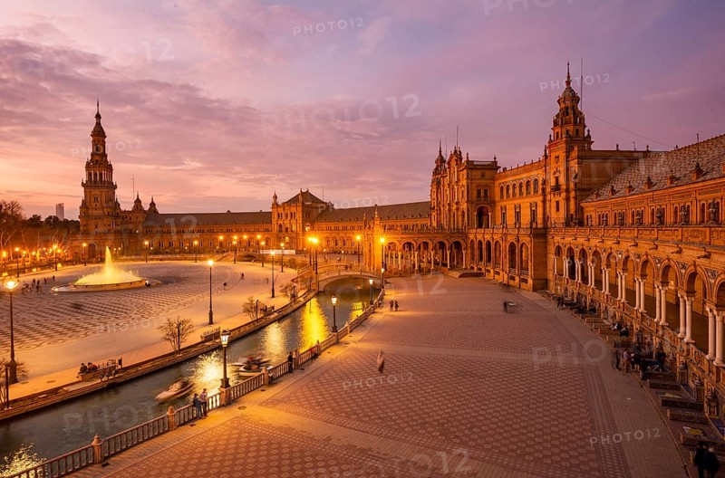 View over the illuminated Plaza de Espana at dusk Panorama
