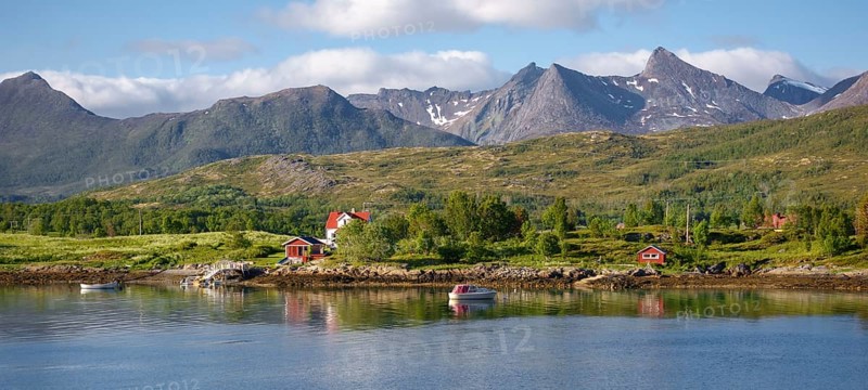 Residential house with boat at the fjord