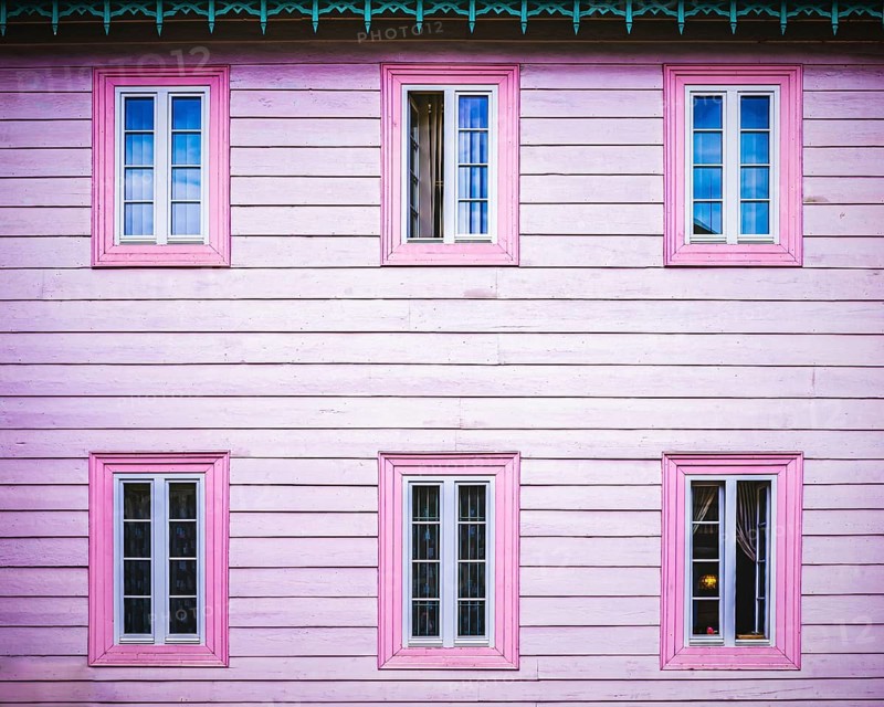 Pink wooden facade with windows