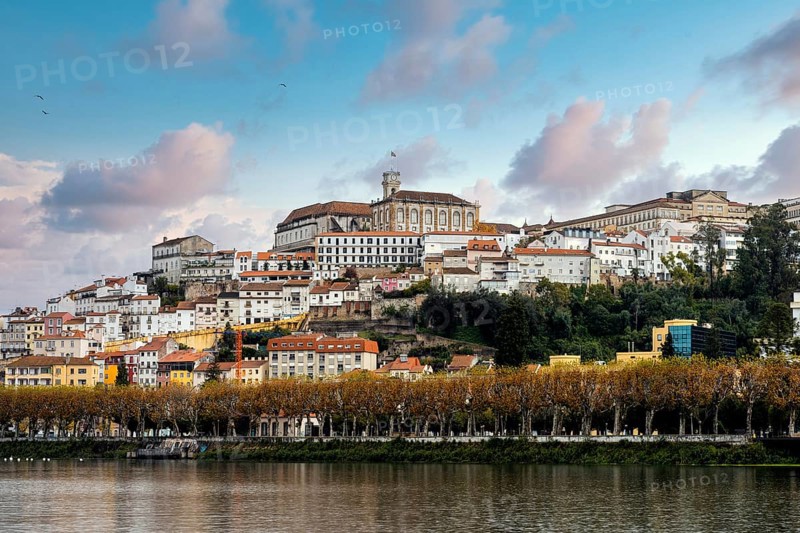 Coimbra cityscape with Mondego river by sunset