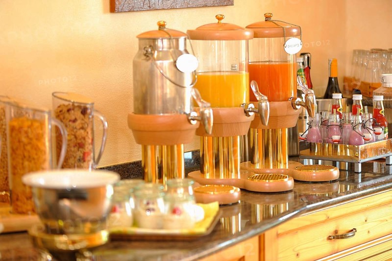 Breakfast buffet with muesli and fruit juices