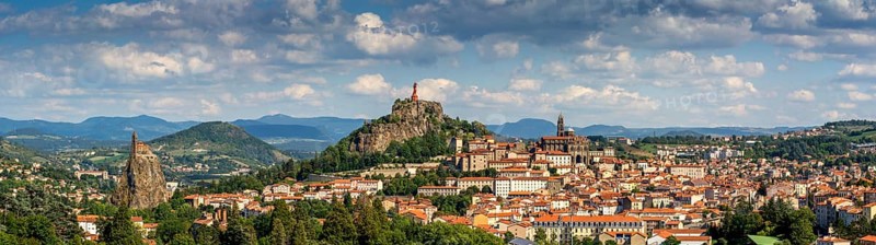 City view with statue of the Virgin Mary Notre Dame de France and cathedral