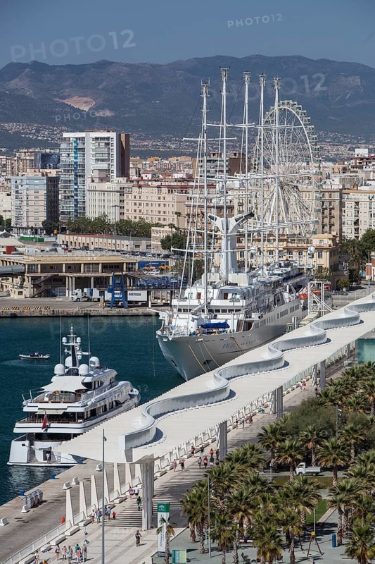 Luxury yachts and Palmeral De Las Sorpresas in the port of Malaga