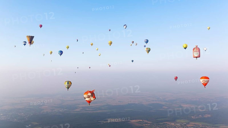 Countless hot air balloons in different colours and shapes
