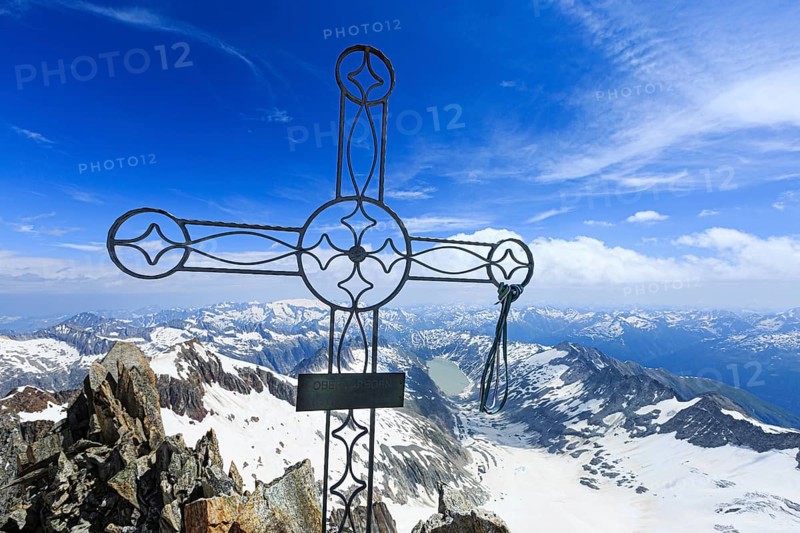Summit cross Oberaarhorn with view of Oberaar glacier and Oberaar lake