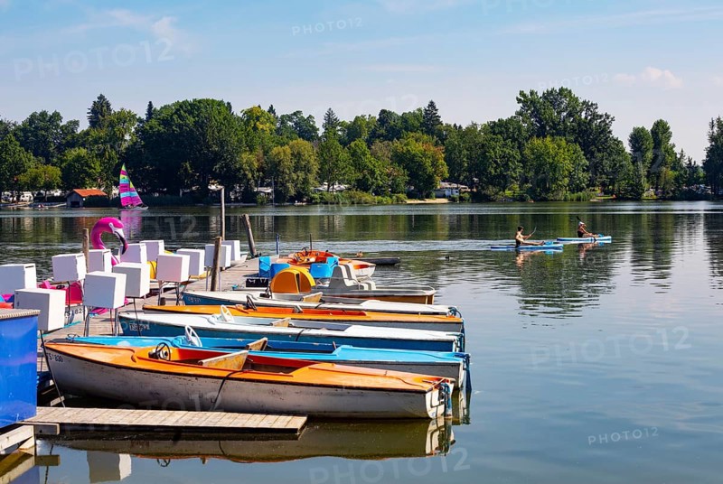 Electric boats on the shore of the Waginger See