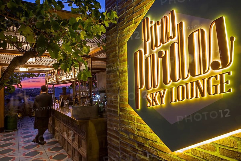 Illuminated neon sign at the corridor of the Bless hotel terrace