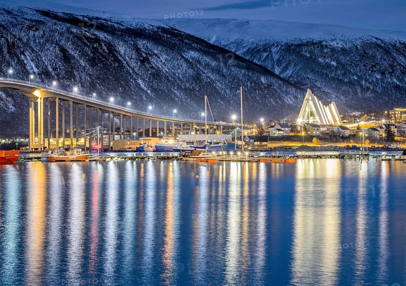 View over the harbour and city with Tromsobrua or Tromso Bridge