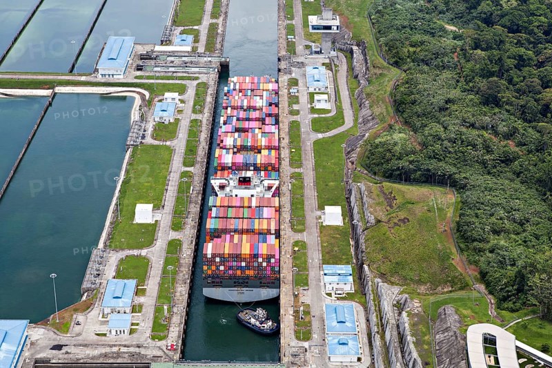 Aerial view of Neo-Panamax container ship crossing the third set of locks at the pacific side