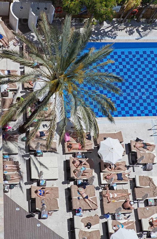 Tourists at the swimming pool in a hotel in Marbella