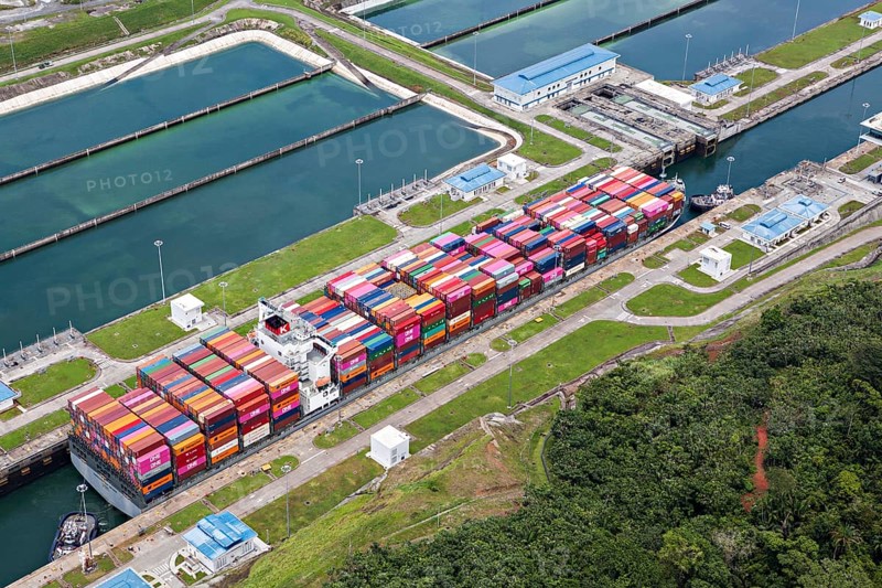 Aerial view of Neo-Panamax container ship crossing the third set of locks at the pacific side