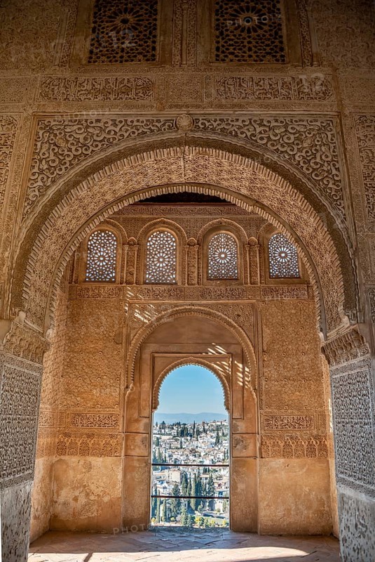 View of the Albayzin district through windows decorated with arabesques