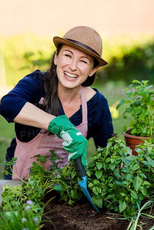 Woman doing gardening on a raised bed