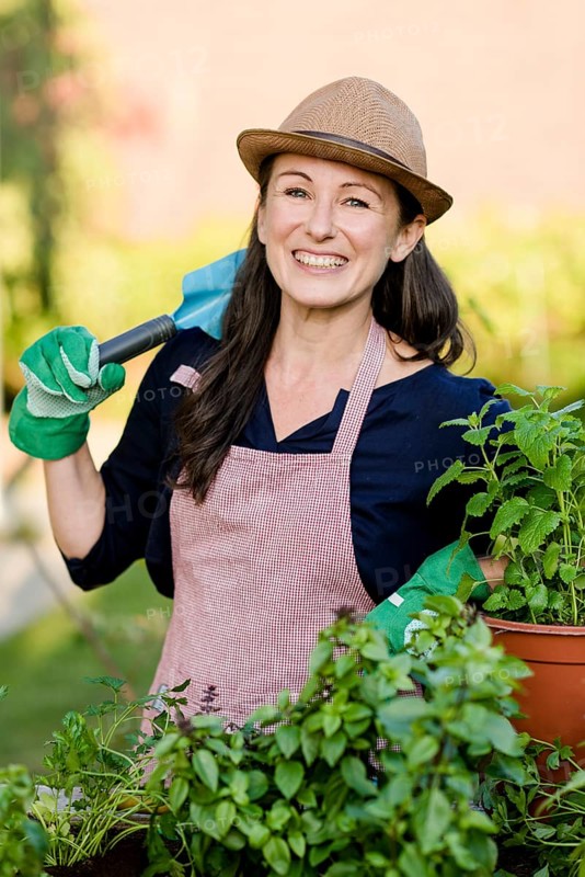 Woman doing gardening on a raised bed
